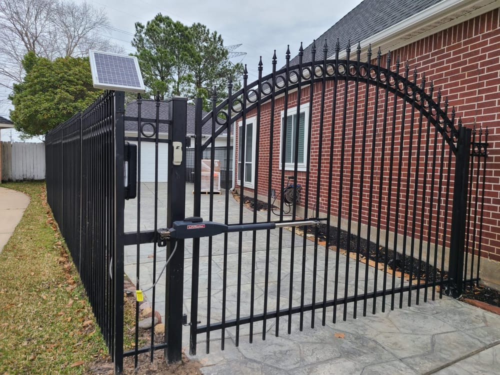Ornamental wrought-iron automatic driveway gate installed in Houston