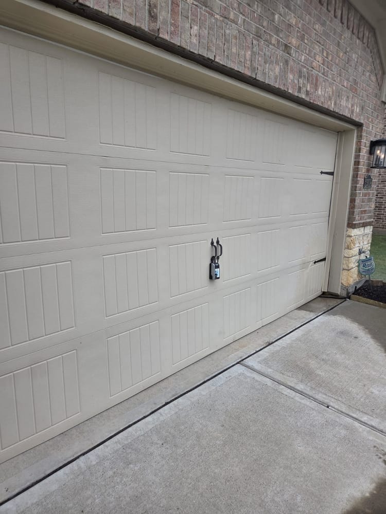 Insulated garage door installed on a brick Houston home