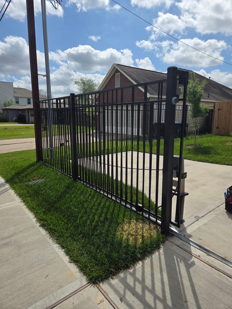Automatic sliding driveway gate installed at a Houston home